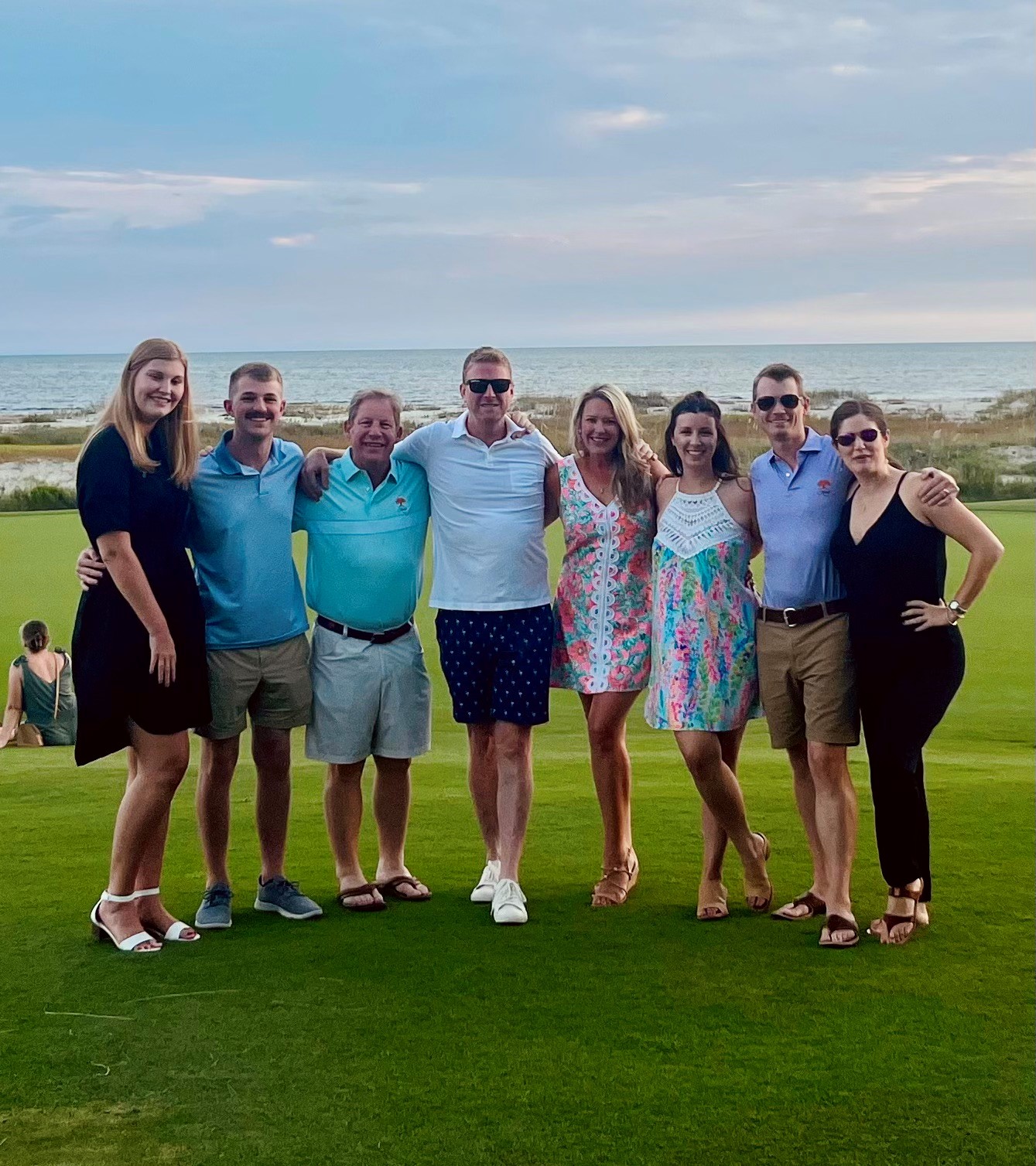 8 people on a summer day in a group photo at kiawah retreat